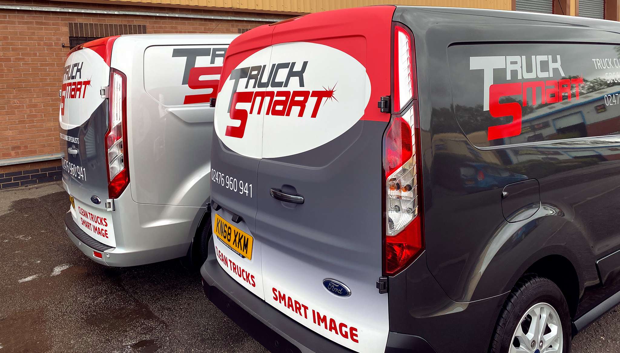 Two Truck Smart branded vans